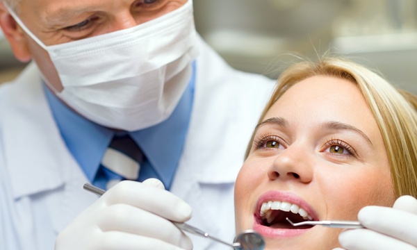 How can visiting a dentist be beneficial for your health?